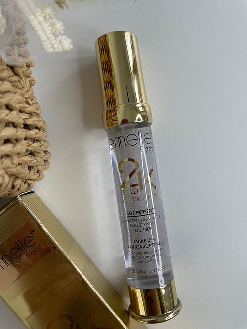 Eamelle skincare serum bottle with gold cap on a white background