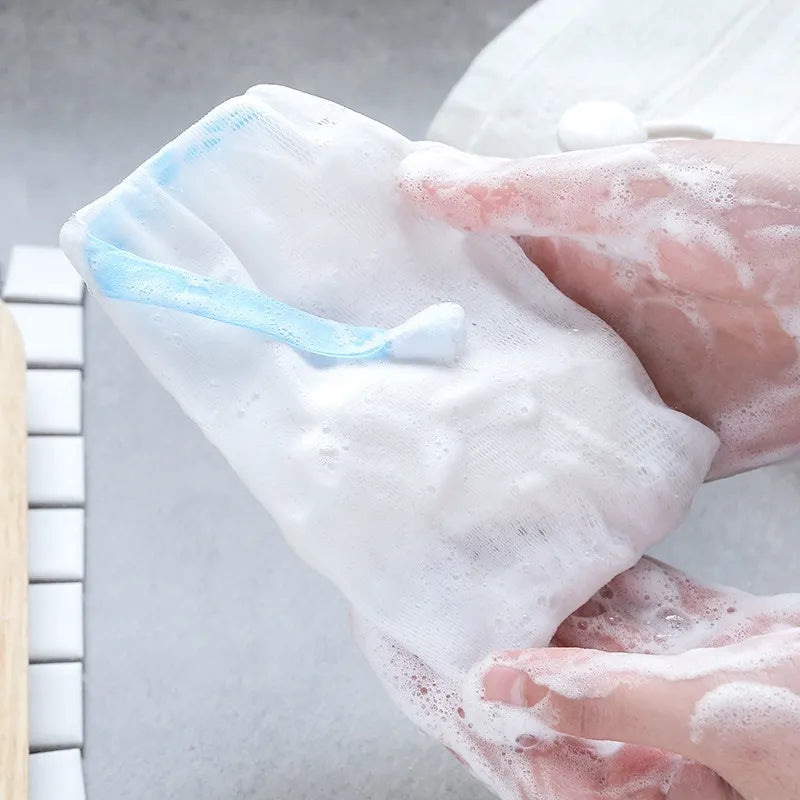 Soap storage drain pouch with a reusable mesh design to help reduce soap residue buildup.
