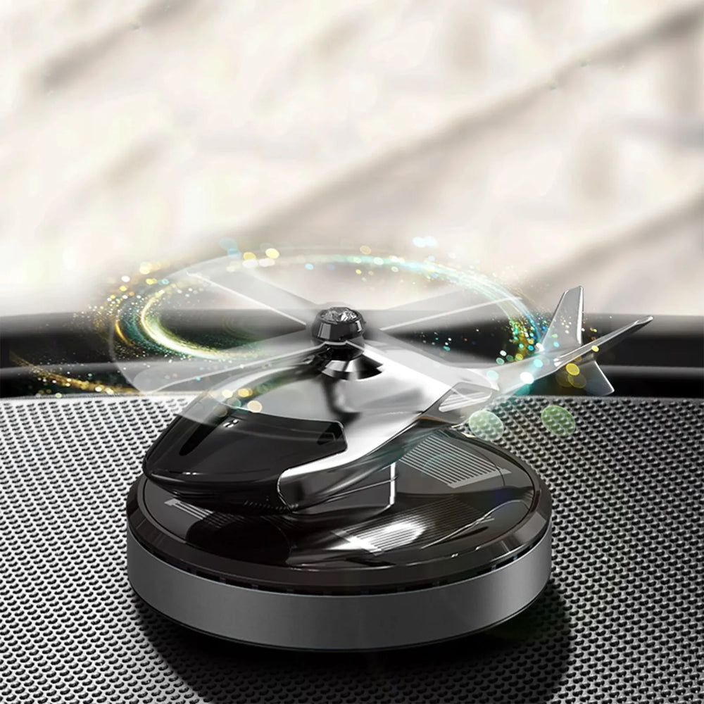 Black and silver drone on a reflective surface with a blurred background