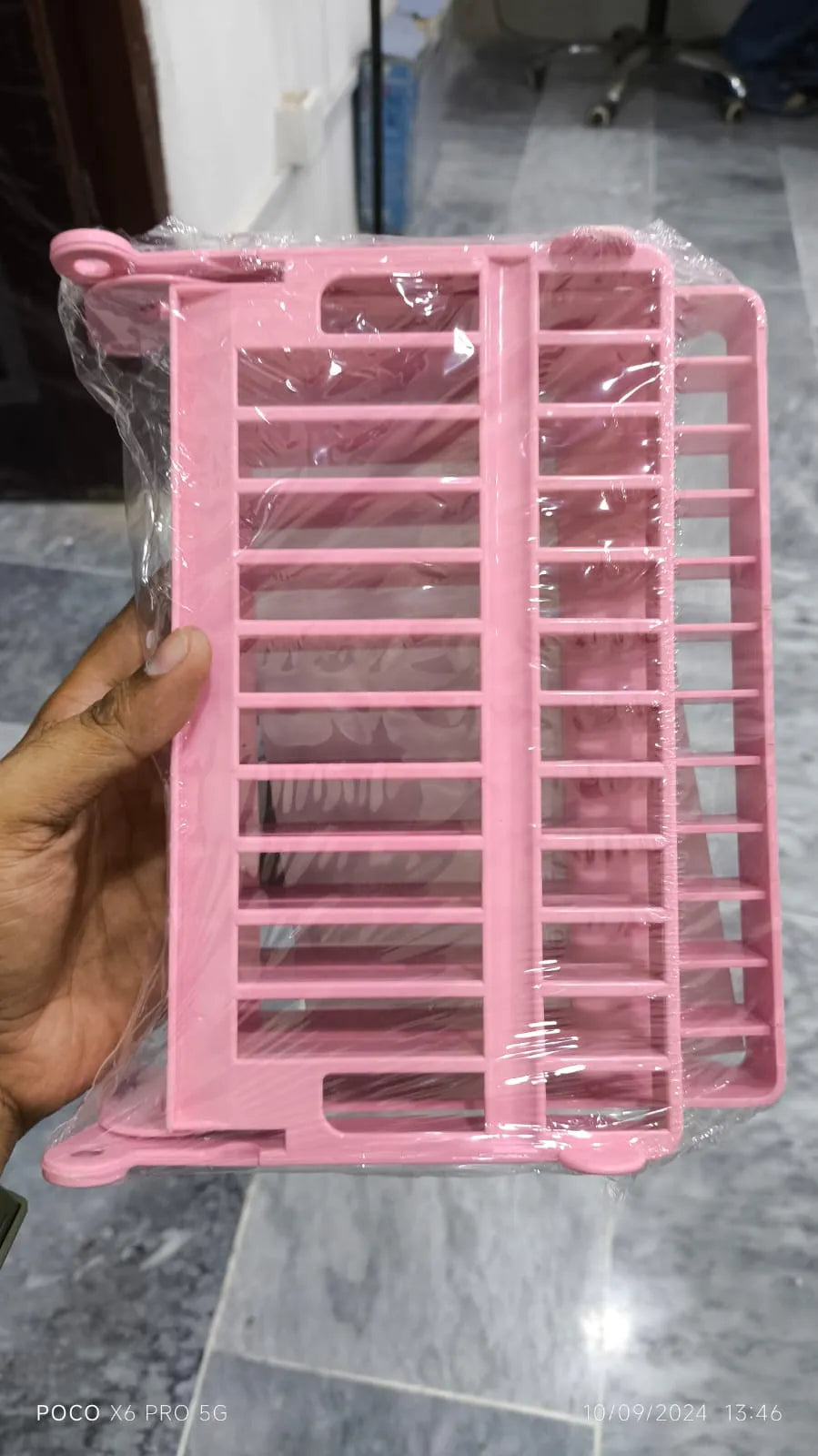 Space-saving dish drying rack ideal for organizing washed dishes on kitchen countertops.