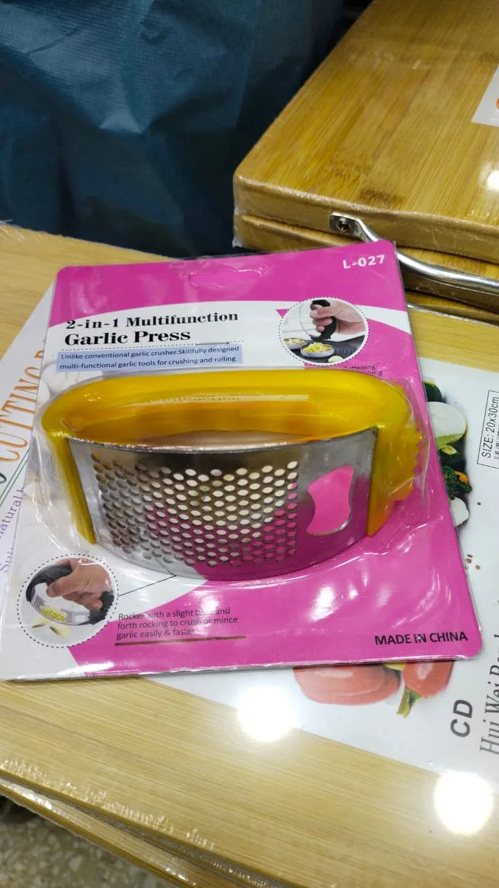 Garlic press with packaging on a table