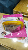 Garlic press with packaging on a table