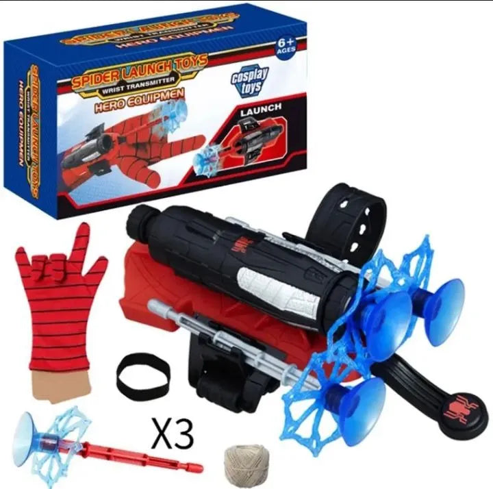 Spider-Man themed toy launch set with a black and red toy blaster, blue suction-cup web shooters, a red glove, a web line spool, a wrist strap, and the retail box on a white background.