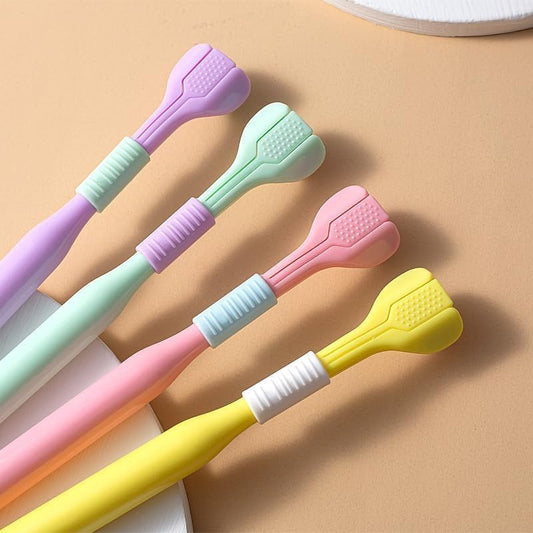 Set of colorful toothbrushes with different colored handles on a beige background