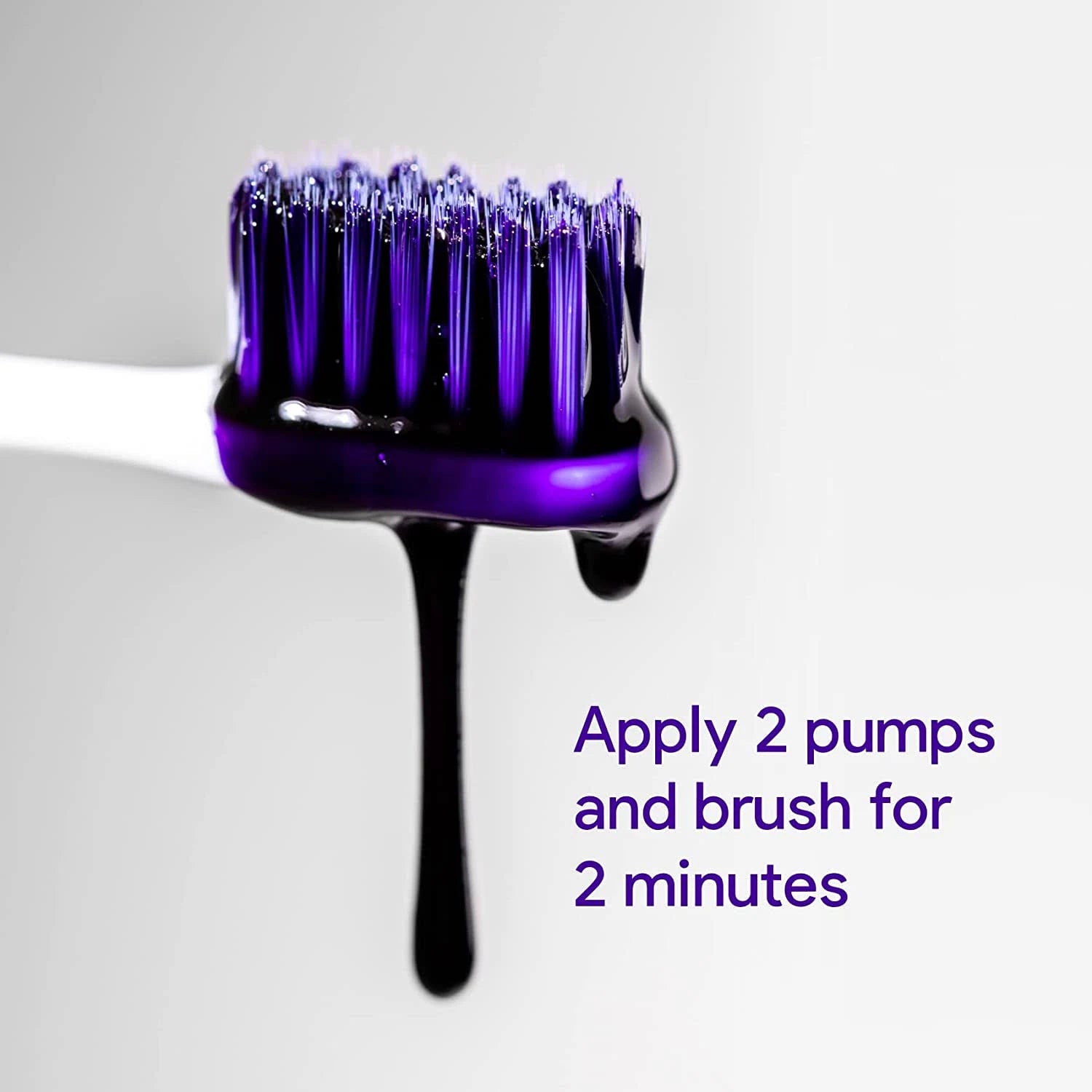 Purple brush with black handle on a white background, showing product application instructions.