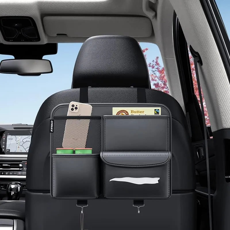 Car back seat organizer with multiple pockets in a vehicle interior.
