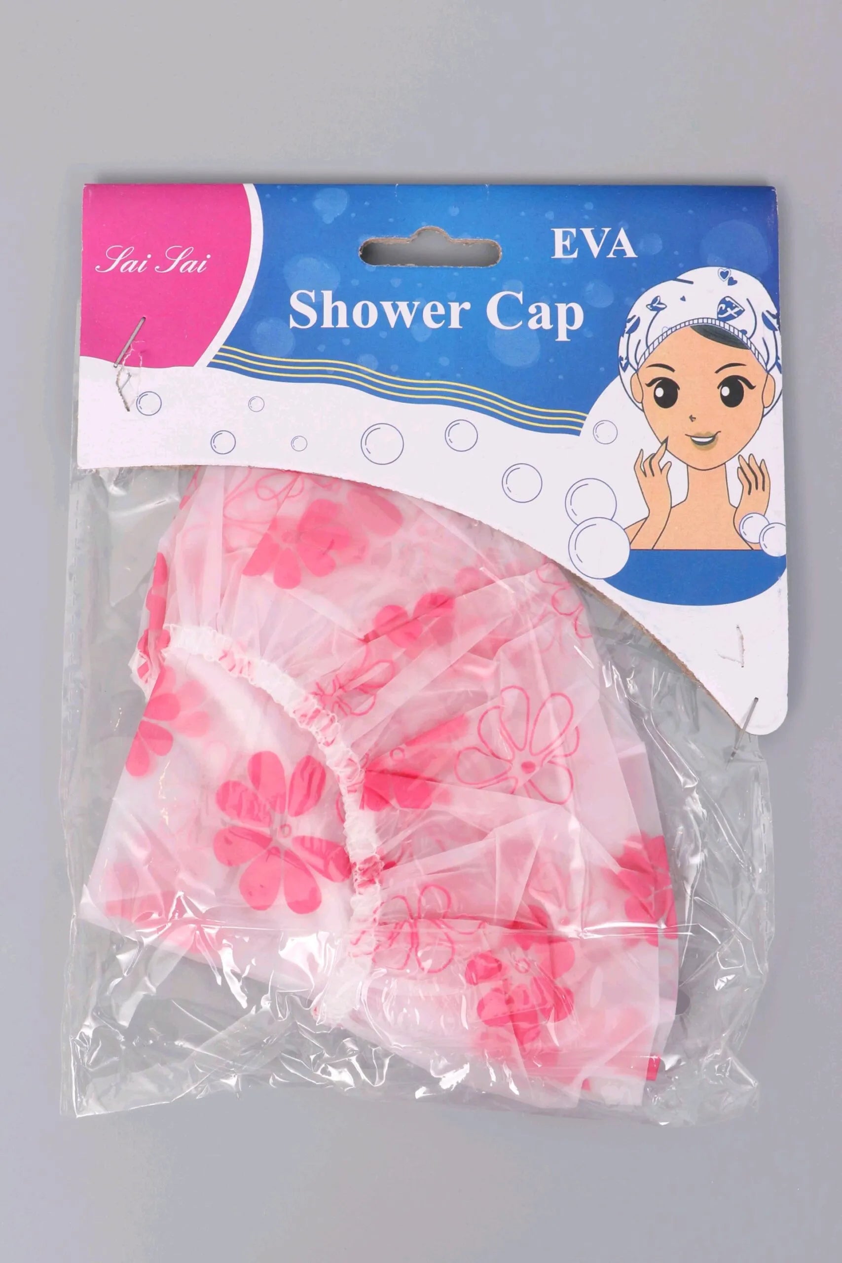 A pink and white floral EVA shower cap in its original retail packaging, featuring a blue and white header card with the brand name 'Tai Tai' and an illustration of a woman wearing a shower cap.