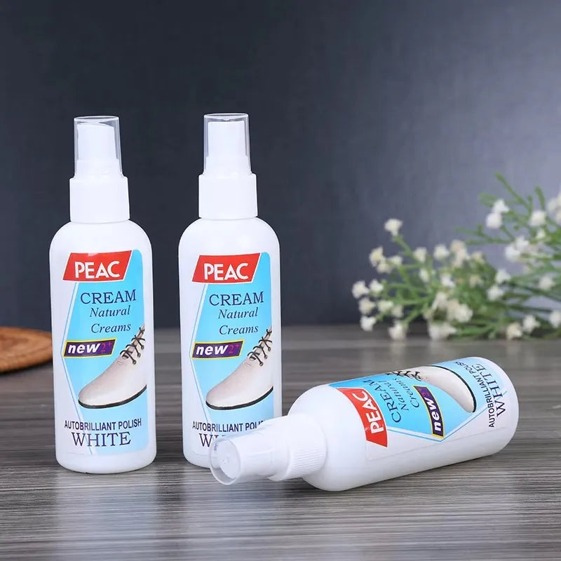 Three bottles of PEAC Cream on a wooden surface with a dark background