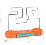 Orange spring-loaded tool with metal frame and measurements on a white background