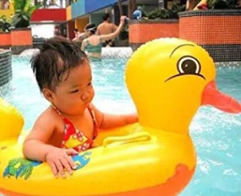 Yellow duck baby pool float with a secure seat for enjoyable swimming experiences.