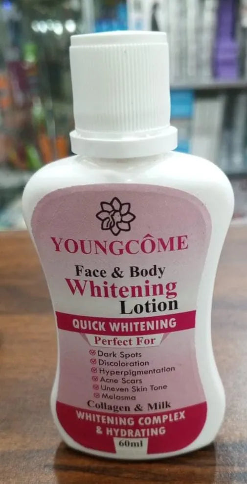 Youngcome Face & Body Whitening Lotion bottle on a wooden surface with a blurred background